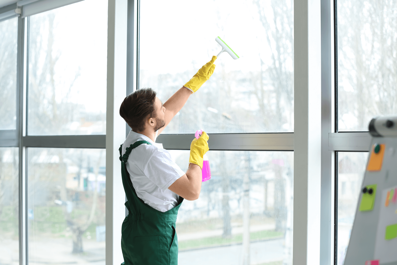 Man Washing a window of a commercial building